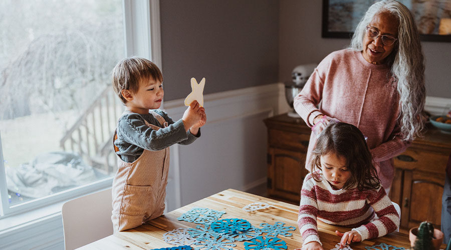 grandmother with grandchildren in kitchen